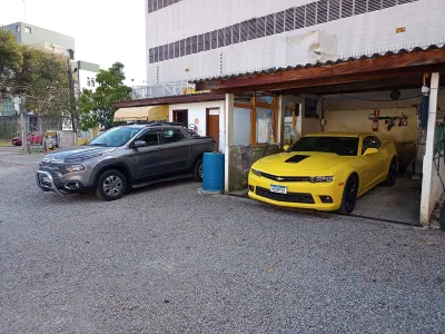 Fachada do estacionamento ESTACIONE ES PARK &. WASH Carros, Ônibus e Caminhões tbm